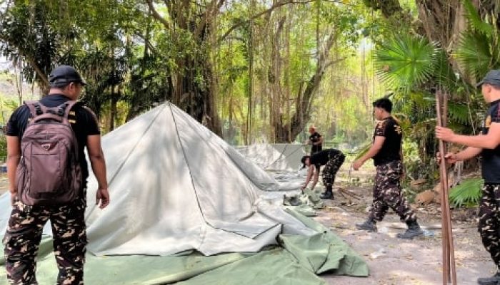 Terbangun Sinergi Harmonis, Banser-Pecalang Kompak Bersih-Bersih Lokasi Apel Kesetiaan PBNU