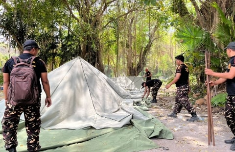 Terbangun Sinergi Harmonis, Banser-Pecalang Kompak Bersih-Bersih Lokasi Apel Kesetiaan PBNU